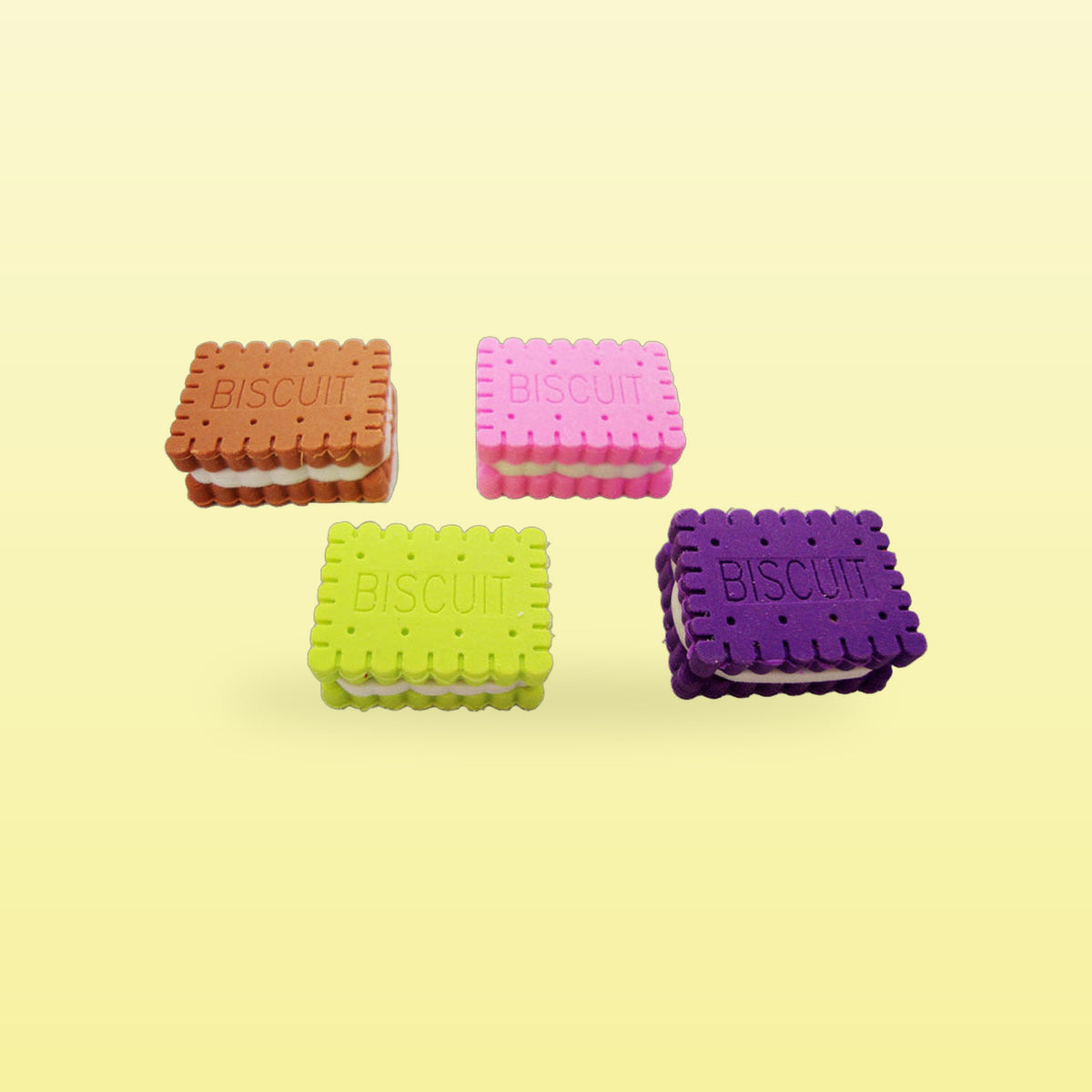 Sandwich biscuit erasers in brown, pink, lime green and purple, all four colours together, on a butter yellow background