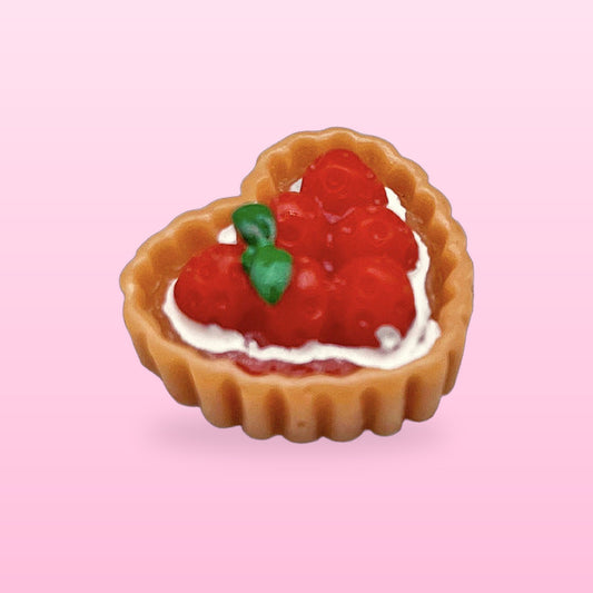 Strawberry heart tart miniature food fridge magnet, on a pink background