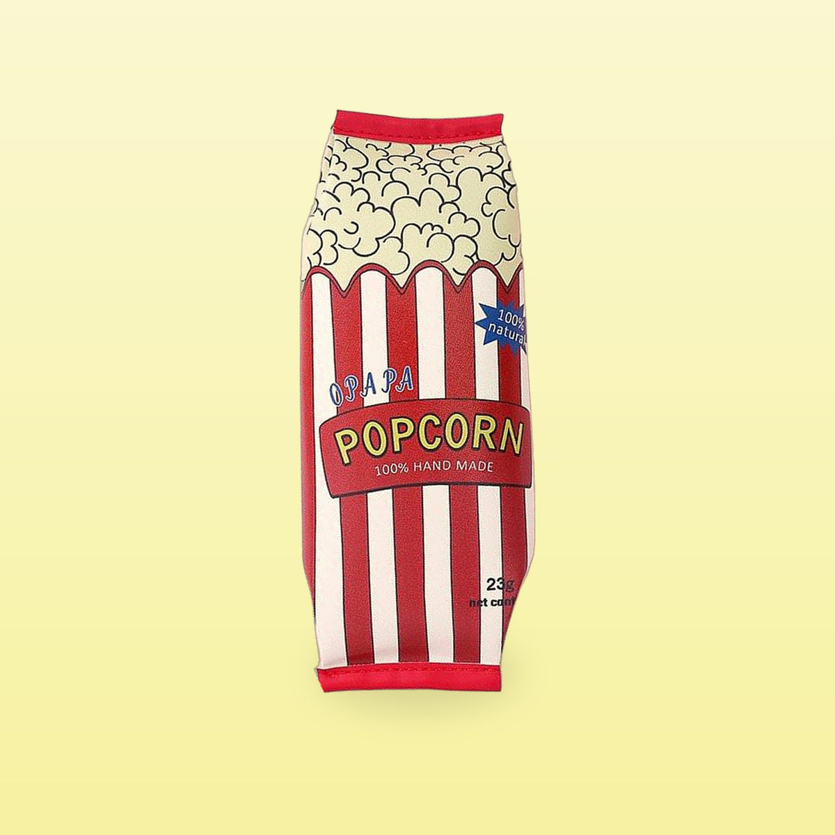 Popcorn snack packet pencil case with red and white stripes, on a butter yellow background