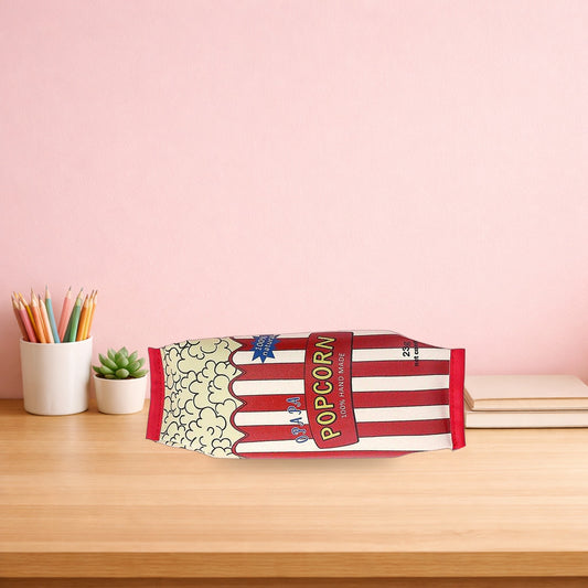 Popcorn snack packet pencil case lying on a light oak desk
