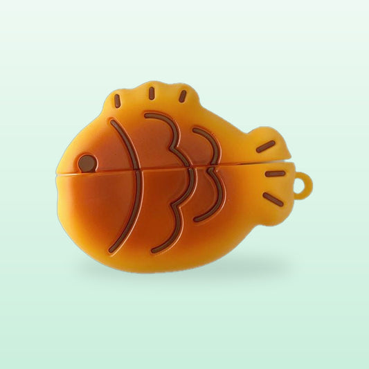 Golden taiyaki fish AirPods case with a loop for a keyring, on a mint background