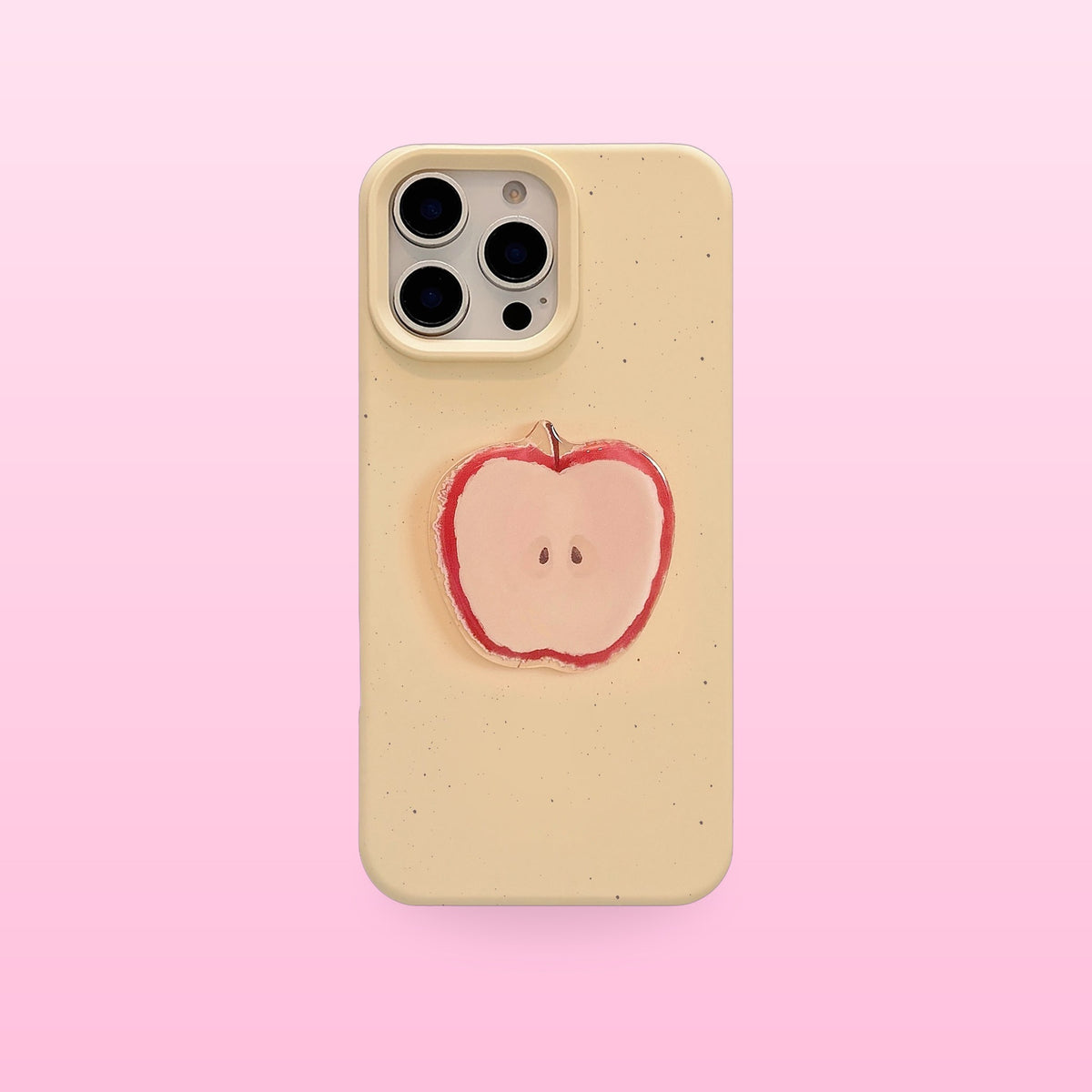 Cream yellow iPhone case with a 3D apple half on a pink background