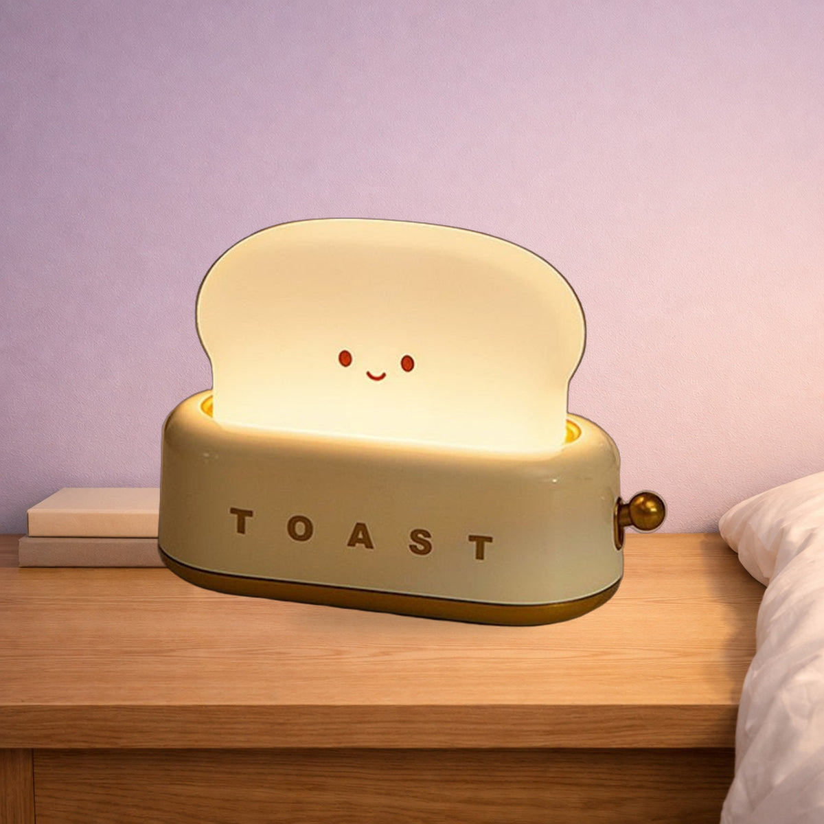 Green toaster night light glowing on an oak bedside table