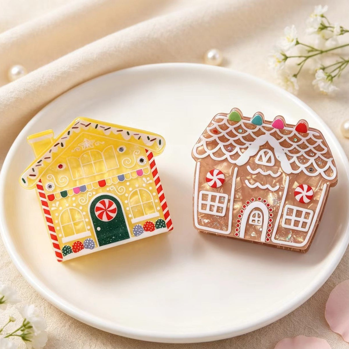 Lemon icing and classic gingerbread house claw clips side by side on a white plate