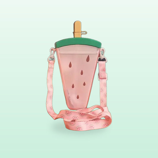 Watermelon ice lolly straw bottle in pink with a green lid and pink shoulder strap, on a mint green background