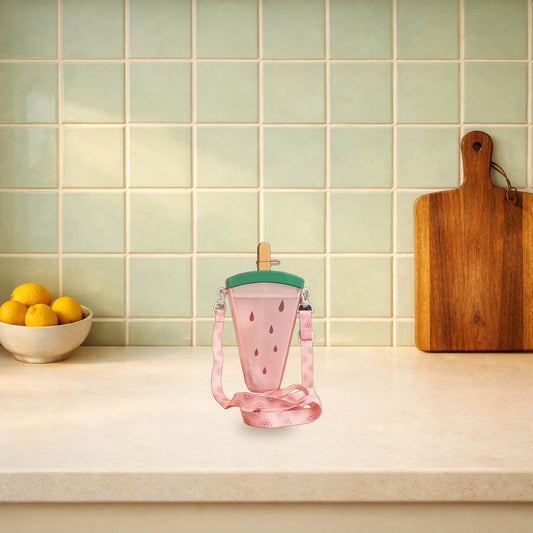 Watermelon ice lolly straw bottle with its strap on a kitchen worktop