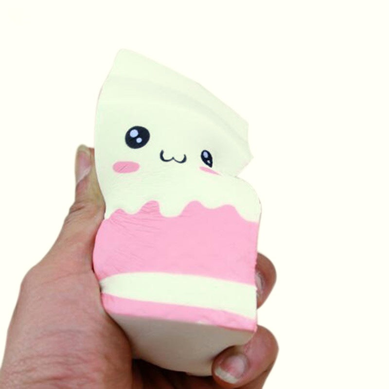 Milk carton squishy squeezed in one hand to show its size and slow rise foam