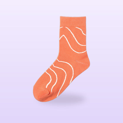 Orange salmon print cotton sock with white wavy stripes, on a soft lilac background