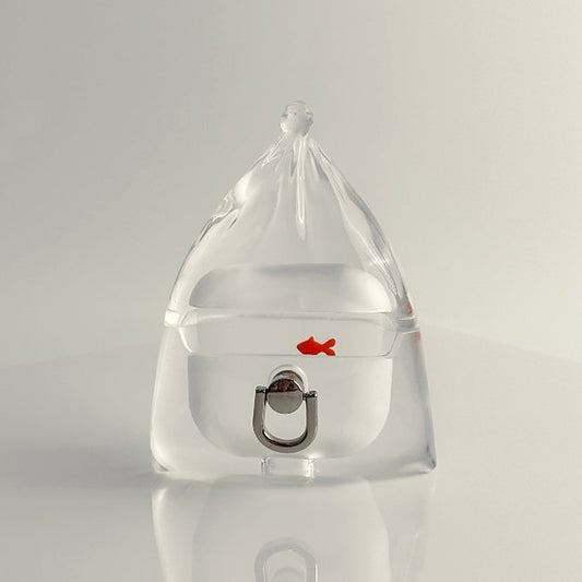 Clear goldfish in a bag AirPods case with a small orange fish and a silver ring loop, on white