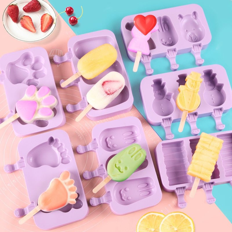 Purple silicone ice lolly moulds in several shapes with homemade lollies