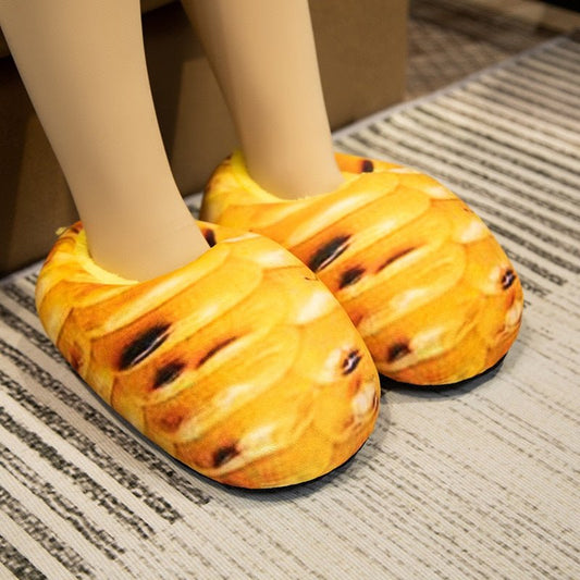 Roasted Corn Bread slippers for adults with golden grilled pattern, worn on a striped rug