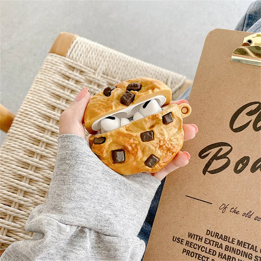 Golden choc chip cookie case for AirPods, open with earbuds inside