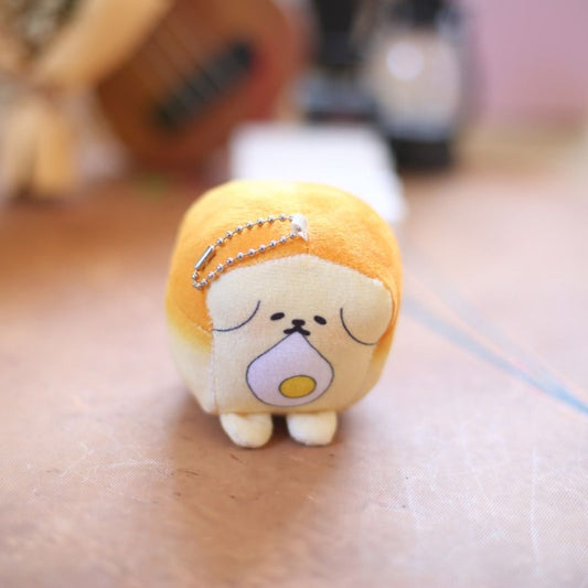 Toast dog plush keychain with a fried egg